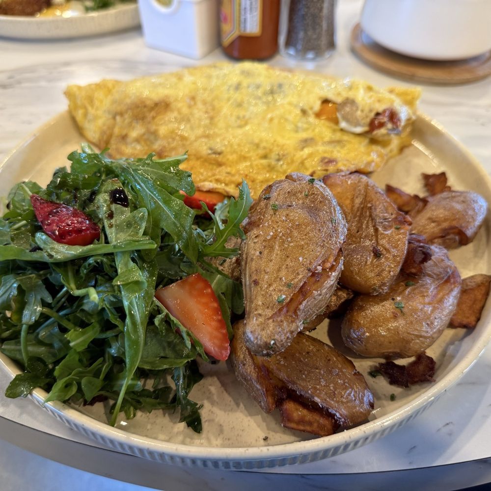 Pretti Platters - Garden Market Omelette with hen of the woods mushrooms, peas, roasted potatoes and an arugula and strawberry side salad - Breakfast & Brunch Near Me - San Anselmo, California Pretti Platters - Garden Market Omelette with hen of the woods mushrooms, peas, roasted potatoes and an arugula and strawberry side salad - Breakfast & Brunch Near Me - San Anselmo, California