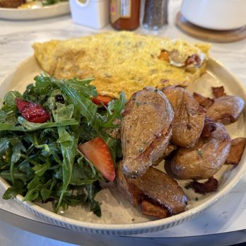 Pretti Platters - Garden Market Omelette with hen of the woods mushrooms, peas, roasted potatoes and an arugula and strawberry side salad - Breakfast & Brunch Near Me - San Anselmo, California Pretti Platters - Garden Market Omelette with hen of the woods mushrooms, peas, roasted potatoes and an arugula and strawberry side salad - Breakfast & Brunch Near Me - San Anselmo, California