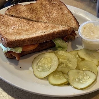 New Beginnings - a sandwich and pickles on a plate - Breakfast & Brunch Near Me - Coopersville, Michigan New Beginnings - a sandwich and pickles on a plate - Breakfast & Brunch Near Me - Coopersville, Michigan