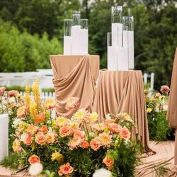 Magical Moments Design & Event Planning - Layered florals and soft draping for a refined, cohesive look.