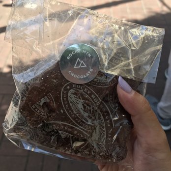 Rocky Mountain Chocolate Factory - a hand holding a bag of rocky mountain chocolate - Chocolatiers & Shops Near Me - Victoria, British Columbia Rocky Mountain Chocolate Factory - a hand holding a bag of rocky mountain chocolate - Chocolatiers & Shops Near Me - Victoria, British Columbia
