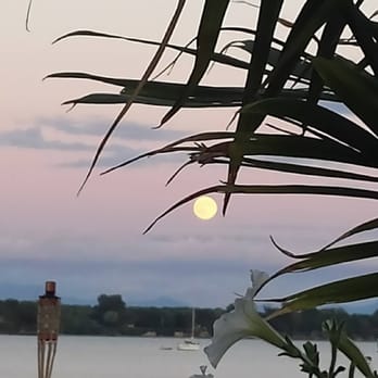 The Cabana Beach Bar - the sun setting over the water - Bars Near Me - Plattsburgh, New York