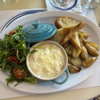 The Med - Oueffs en cocotte - cream semi poached eggs with fingerling potatoes and arugula salad - Mediterranean Near Me - Naples, Florida The Med - Oueffs en cocotte - cream semi poached eggs with fingerling potatoes and arugula salad - Mediterranean Near Me - Naples, Florida