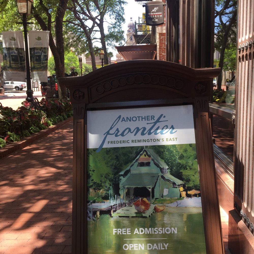 The museum's sidewalk sandwich board with the courthouse deep in the background. The museum's sidewalk sandwich board with the courthouse deep in the background.