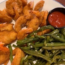 a plate of fried shrimp, green beans, and dipping sauce a plate of fried shrimp, green beans, and dipping sauce