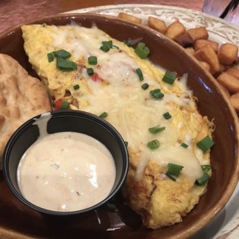 Another Broken Egg Cafe - Stan's Mardigras Omelette with white cheddar cheese and hollandaise sauce on the side. Amazing! - Breakfast & Brunch Near Me - Pembroke Pines, Florida