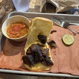 Beef Brisket Sandwich with choice of side Beef Brisket Sandwich with choice of side