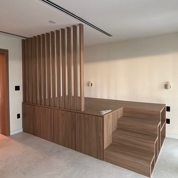 Monarch Custom Finishes - Modern bedroom with seamless microcement flooring and custom wood slat divider. The minimalist, Japandi-inspired look our cli... - Roofing Near Me - Deerfield Beach, Florida Monarch Custom Finishes - Modern bedroom with seamless microcement flooring and custom wood slat divider. The minimalist, Japandi-inspired look our cli... - Roofing Near Me - Deerfield Beach, Florida