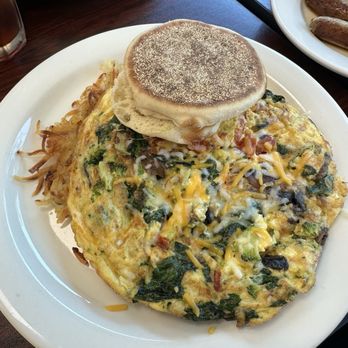 Tasty Nook Cafe - Super Veggies Omelet with English muffin. The potatoes are under the omelette. - Cafes Near Me - Rockville, Maryland Tasty Nook Cafe - Super Veggies Omelet with English muffin. The potatoes are under the omelette. - Cafes Near Me - Rockville, Maryland