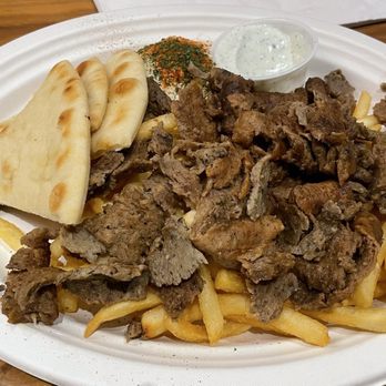Luna Grill Chino Hills - Gyro Meat Plate on Fries with Spicy Harissa Hummus and Tzatziki sauce - Greek Near Me - Chino Hills, California Luna Grill Chino Hills - Gyro Meat Plate on Fries with Spicy Harissa Hummus and Tzatziki sauce - Greek Near Me - Chino Hills, California