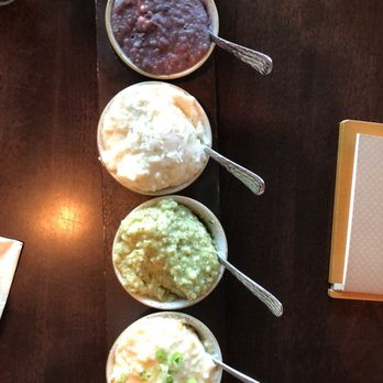 Grace & Grit - Grit flight!! Top to bottom: Blueberry (sweet), coconut cream (sweet), Brussels pesto (savory), and Pimento Cheese (savory) - Southern Near Me - Mount Pleasant, South Carolina