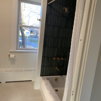 Kit Renovation - Shower and flooring after reno - General Contractors Near Me