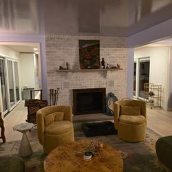 EvolveD Interiors Design and Build - Fireplace red brick was painted dreamy white. Ceiling reflections.