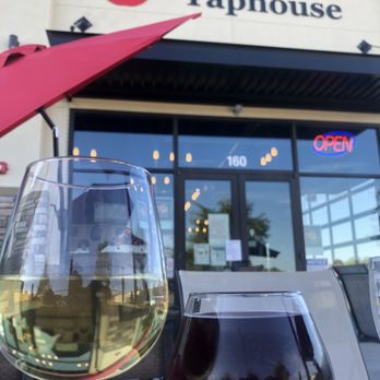 Good Apple Taphouse - two glasses of wine on a table - Beer Bar Near Me - Meridian, Idaho Good Apple Taphouse - two glasses of wine on a table - Beer Bar Near Me - Meridian, Idaho