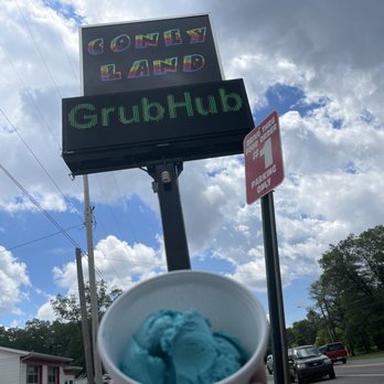 Coney Land - a hand holding a cup of ice cream - Ice Cream & Frozen Yogurt Near Me - Muskegon, Michigan