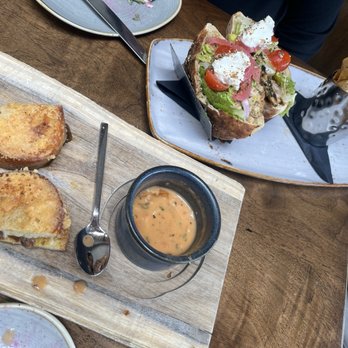 GRANVILLE - Artisan Grilled Cheese Dipper with Garlic Tomato Bisque Cup, Hummus Pita Sandwich with Chicken and house made Herb Potato Chips - New American Near Me - Studio City, California GRANVILLE - Artisan Grilled Cheese Dipper with Garlic Tomato Bisque Cup, Hummus Pita Sandwich with Chicken and house made Herb Potato Chips - New American Near Me - Studio City, California