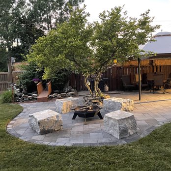 Forma Landscape & Design - a patio with a fire pit - Lawn Services Near Me - Elora, Ontario Forma Landscape & Design - a patio with a fire pit - Lawn Services Near Me - Elora, Ontario