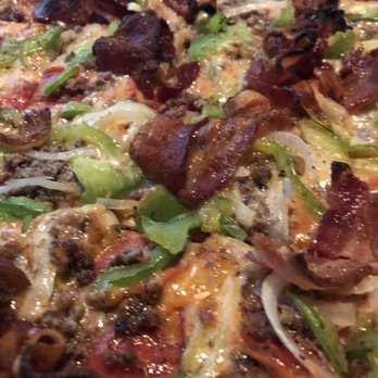 Bill Gianino's Restaurant - Look at that bacon on Frank's special delight pizza! - Italian Near Me - Saint Louis, Missouri