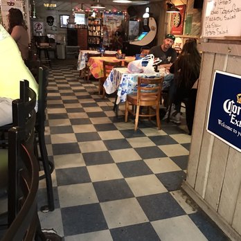 Wind Rose Cafe - people sitting at tables in a restaurant - Bars Near Me - Tybee Island, Georgia Wind Rose Cafe - people sitting at tables in a restaurant - Bars Near Me - Tybee Island, Georgia