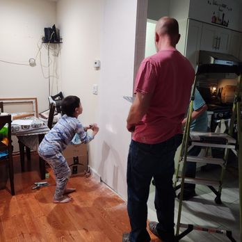 The Sliding Door Company - My son helping our contractor paint thr newly installed dry wall - Door Sales/Installation Near Me - Chatsworth, California
