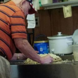 Best Pizza Dairy Bar - Mr. Chet making our large meat lovers.