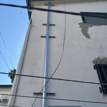 Seven Electric - This is called the riser that leaves the meter panel and goes to the roof where the power company connects cables - Electricians Near Me - Beverly Hills, California