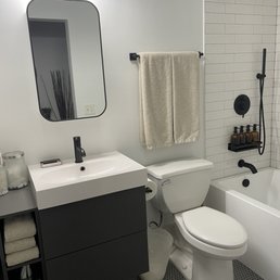 Floor tile, toilet install, tub install, tub surround, floating vanity assembly and install, tub fixture install.