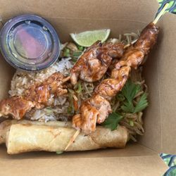 Manila Grille - Combo with chicken skewers rice pancit and lumpia.