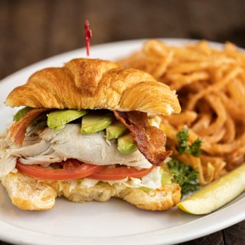 Corky's Kitchen & Bakery - a croissant sandwich on a plate - American Near Me - Ladera Ranch, California Corky's Kitchen & Bakery - a croissant sandwich on a plate - American Near Me - Ladera Ranch, California
