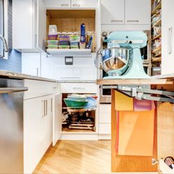 All Eco Design Center - Accessible features in kitchen - hydraulic pull down in upper cupboard and for mixer lifting