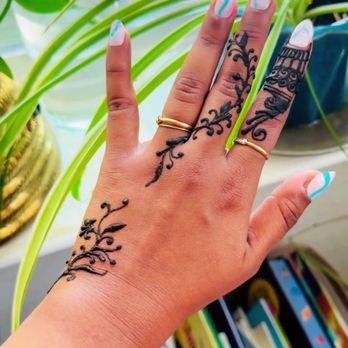 Mehendi By Wini - Hands with henna on them - Henna Artists Near Me Mehendi By Wini - Hands with henna on them - Henna Artists Near Me
