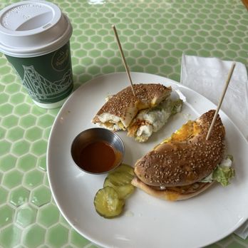 Doppio Coffee & Brunch - Mocha to go, Sesame Seed Bagel Doppios Bagel with Avocado, pickles, a little side of what I believe is Valentina - Coffee & Tea Near Me - San Francisco, California Doppio Coffee & Brunch - Mocha to go, Sesame Seed Bagel Doppios Bagel with Avocado, pickles, a little side of what I believe is Valentina - Coffee & Tea Near Me - San Francisco, California