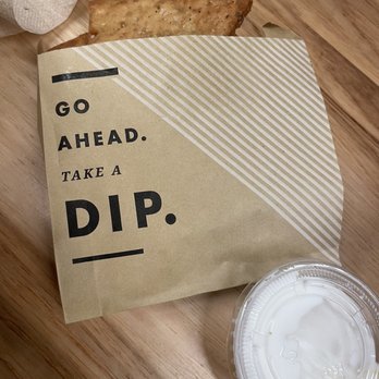 CAVA - Pita chips and garlic dressing - Mediterranean Near Me - New York, New York CAVA - Pita chips and garlic dressing - Mediterranean Near Me - New York, New York
