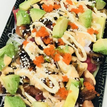 Sushi Q Bar - a black plate with a salad on it - Japanese Near Me - Sewell, New Jersey