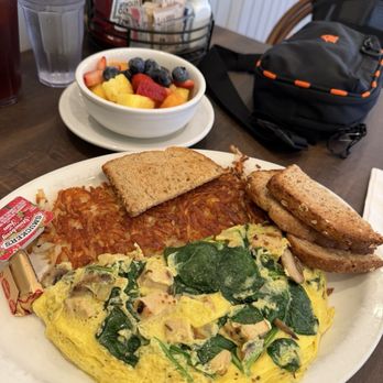 Brothers Cafe - Delicious Scramble with Chicken, Spinach, mushrooms, and Swiss cheese. Order of fruit and wheat toast to bring it all together. - Breakfast & Brunch Near Me - Millbrae, California