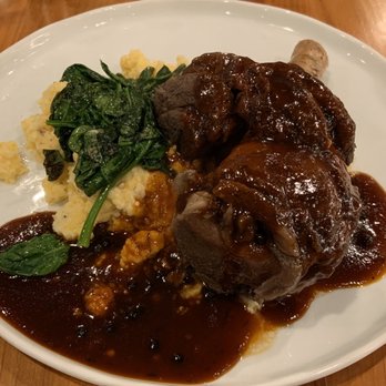 Libro at Laurelwood - Lamb Shank over Gouda Grits and Spinach - Bars Near Me - Memphis, Tennessee Libro at Laurelwood - Lamb Shank over Gouda Grits and Spinach - Bars Near Me - Memphis, Tennessee