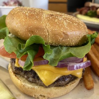 Foster Farms - a cheeseburger with lettuce, tomato, onion, and pickle - American Near Me - Livingston, California