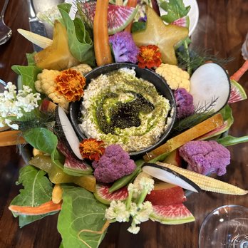 Adeline - Goat Cheese Ricotta with Dill Oil served with a bouquet of veggies and fruit - Cocktail Bars Near Me - Sarasota, Florida