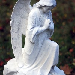 Crown Hill Foundation - This beautiful angel, not much more than a foot tall, has the words to "Silent Night" carved on its base in German.