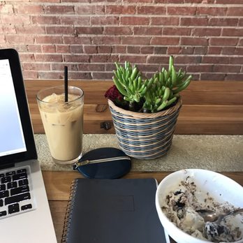 Aurora - Yogurt bowl and iced honey latte at the community table - Coffee & Tea Near Me - Oklahoma City, Oklahoma