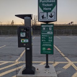 Wilson Subway Station - Main lot signage about price & Green P pay machine in the main lot. This lot is officially Green P Lot 811 November 2020