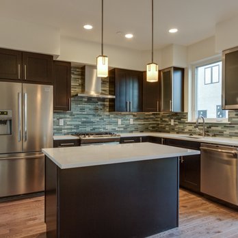 Kahn Enterprises - a kitchen with stainless steel appliances - General Contractors Near Me - Kenner, Louisiana Kahn Enterprises - a kitchen with stainless steel appliances - General Contractors Near Me - Kenner, Louisiana