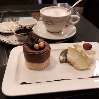 De Proeverie - Breakfast of champions? A lovely chocolate hazelnut cake and hot chocolate. Mmmmmmmm. - Coffee & Tea Near Me - Bruges, VWV De Proeverie - Breakfast of champions? A lovely chocolate hazelnut cake and hot chocolate. Mmmmmmmm. - Coffee & Tea Near Me - Bruges, VWV