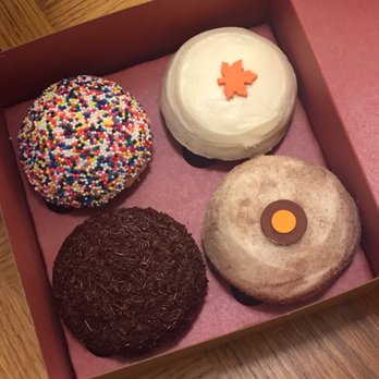 Sprinkles Georgetown - Right to left: classic sprinkles cupcake, orange cranberry with cream cheese icing, triple cinnamon cupcake and chocolate vanilla cupcake - Bakeries Near Me - Washington, DC, District of Columbia Sprinkles Georgetown - Right to left: classic sprinkles cupcake, orange cranberry with cream cheese icing, triple cinnamon cupcake and chocolate vanilla cupcake - Bakeries Near Me - Washington, DC, District of Columbia