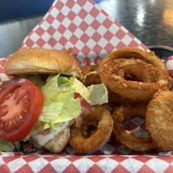 Woods & Main - Grilled chicken bacon Ranch sandwich with a side of onion rings