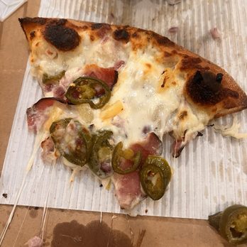 Champ Pizza - This is after it went back in our oven at home. Soggy mess. - Pizza Near Me - Vancouver, Washington