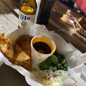Ta'CoNChile - a basket of food and a bottle of beer - Mexican Near Me - Spring, Texas