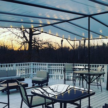 The Hideout - a patio with tables and chairs - Bars Near Me - Goldsboro, North Carolina The Hideout - a patio with tables and chairs - Bars Near Me - Goldsboro, North Carolina