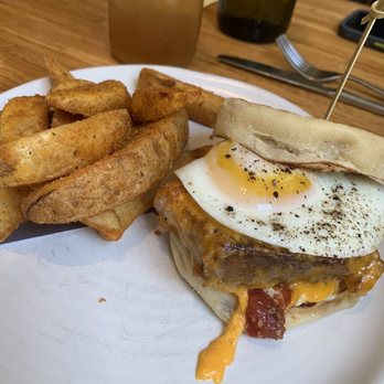 Husk - English Muffin, Pork Belly, & Egg Sandwich ($17) - American Near Me - Charleston, South Carolina
