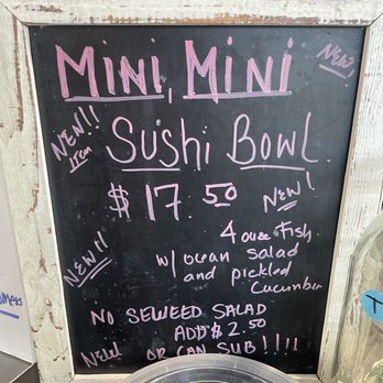 Aloha Cones - A chalkboard sign with pink and purple handwritten text promoting a sushi bowl for $17.50, including details about ingredients and options. - Poke Near Me - Denver, Colorado